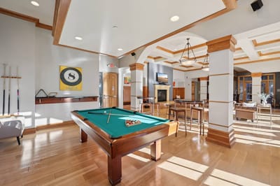 Common area with a billiards table and seating
