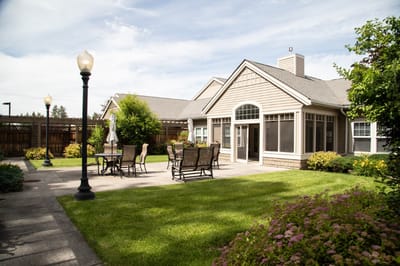 Outdoor patio area with seating and landscaping