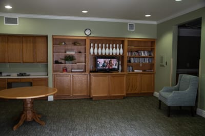 Interior view of a common area with furniture and TV