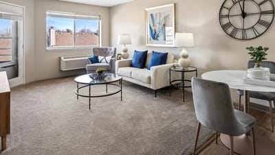Bright and inviting interior living space with a sofa and dining area