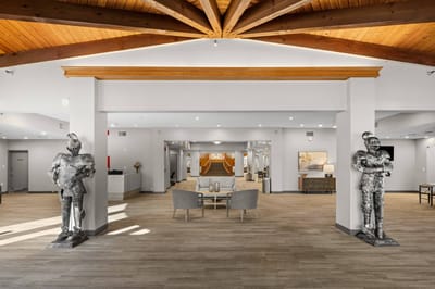 Interior view of a modern lobby with sculptures
