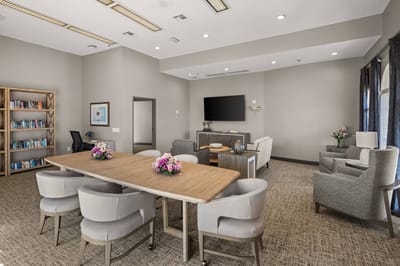 Bright common area with seating and bookshelves
