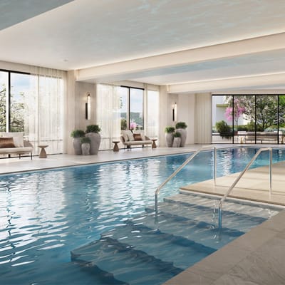 Indoor swimming pool with sunlight and seating