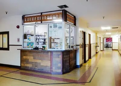 Reception area of a senior living facility with open hallway