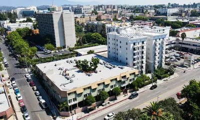 Aerial view of two buildings in an urban senior living community