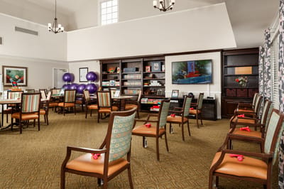 Bright activity room with chairs and games