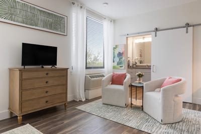 A bright, modern interior of a resident room