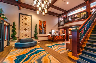 Bright and welcoming lobby area with seating and art