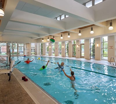 Residents enjoying a group swim in the indoor pool
