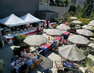 Residents enjoying outdoor dining with parasols
