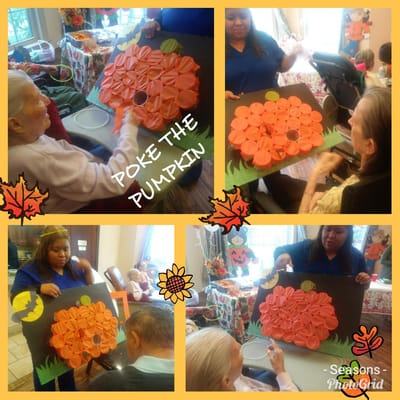 Residents engaging in a pumpkin activity.