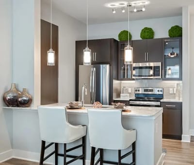 Modern kitchen interior with seating and appliances