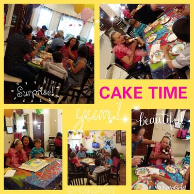 Residents celebrating a birthday with cake and decorations