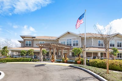 Exterior view of Ivy Park at Pleasanton with landscaped entrance