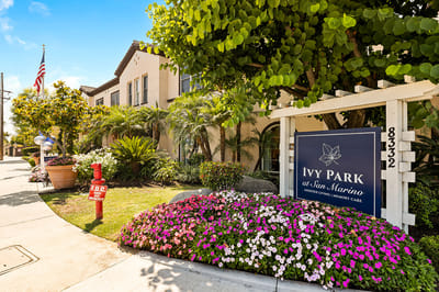 Exterior view of Ivy Park at San Marino with flowers and signage