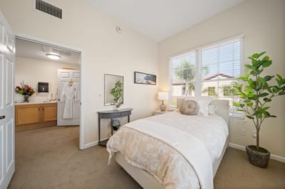 Bright, well-decorated resident room with natural light