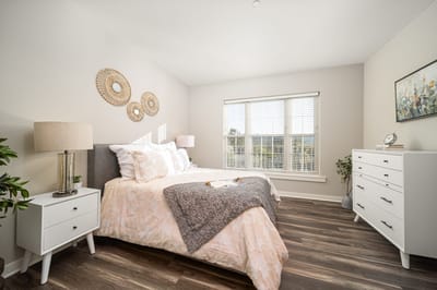 Bright, well-decorated private bedroom in a facility