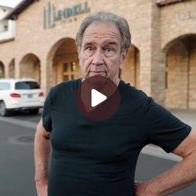 A man standing in front of the Lindell Living facility