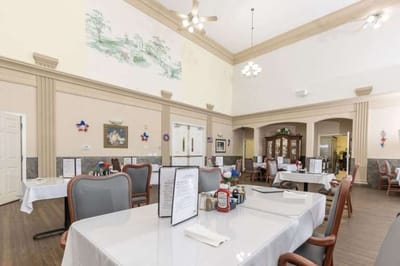Dining area with tables set for residents