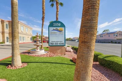 Signage of Desert View Senior Living with palm trees