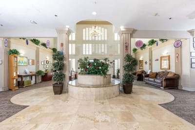 Bright lobby area with plants and seating