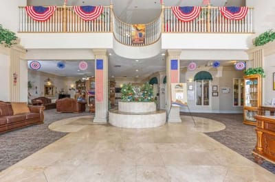 Common area decorated for a celebration with banners and flowers