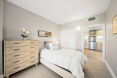Cozy resident room with a bed and dresser