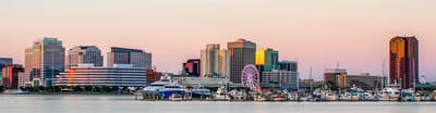Aerial view of a city skyline at sunset
