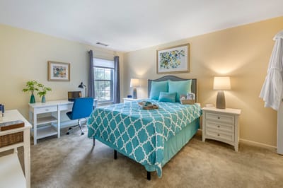 Cozy resident room with a bed and desk
