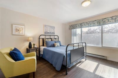 Cozy resident bedroom with natural light