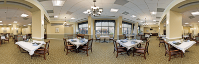 Bright dining room with table settings and natural light