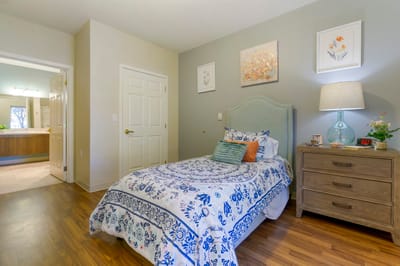 Cozy private resident room with floral bedding