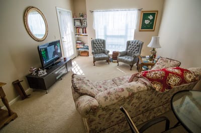 Cozy living room with armchairs and a TV