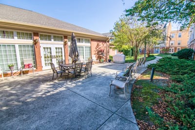 Outdoor seating area with tables and chairs