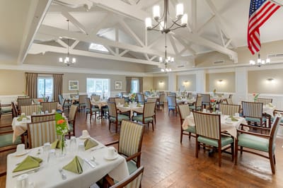 Bright dining room setup with tables and chairs