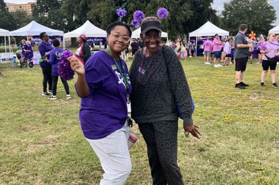 Residents and staff celebrating at an outdoor community event