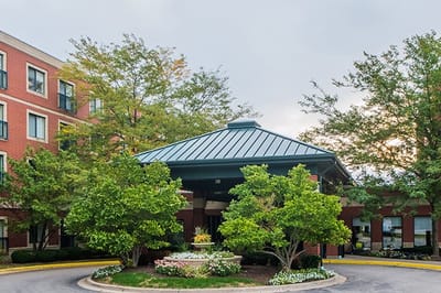 Exterior view of the facility entrance with landscaping