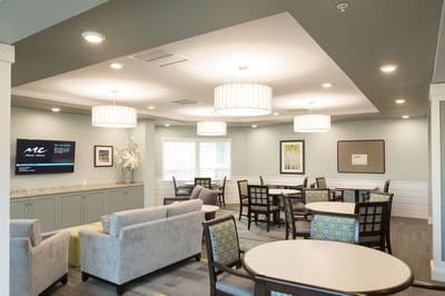 Bright common area with seating and tables