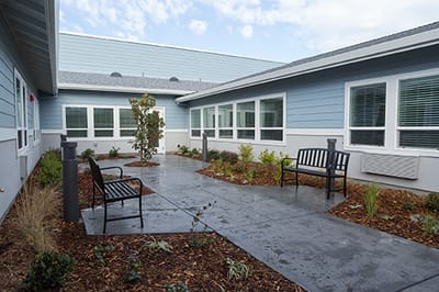 Outdoor courtyard with benches and landscaping