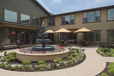 Well-maintained outdoor area with a fountain and seating