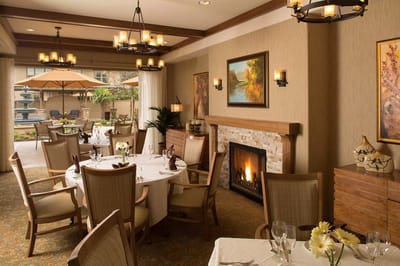 Elegant dining room with tables set for a meal