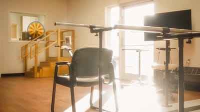 Empty rehabilitation space with equipment and sunlight