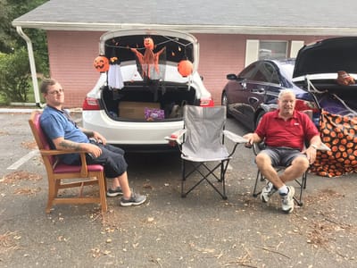 Residents celebrating Halloween in the parking lot