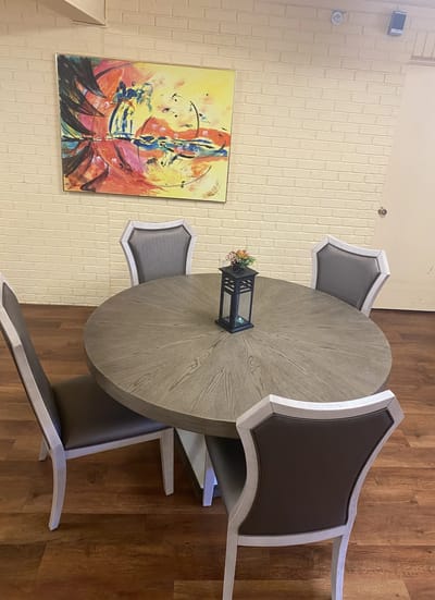Common area with a round table and chairs