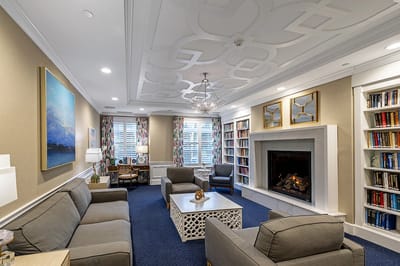 Cozy common area with seating and bookshelves