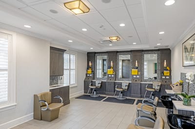 Interior view of a salon area with hair styling stations