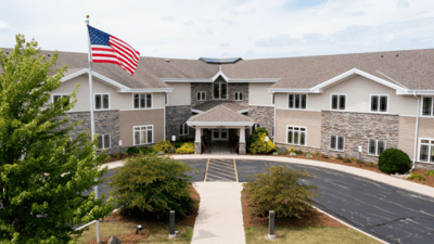 Exterior view of Pine Haven Christian Communities with flag