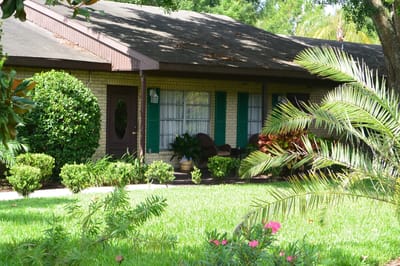 Exterior view of a residential building with garden