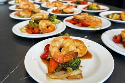 Plated shrimp and vegetables on a table