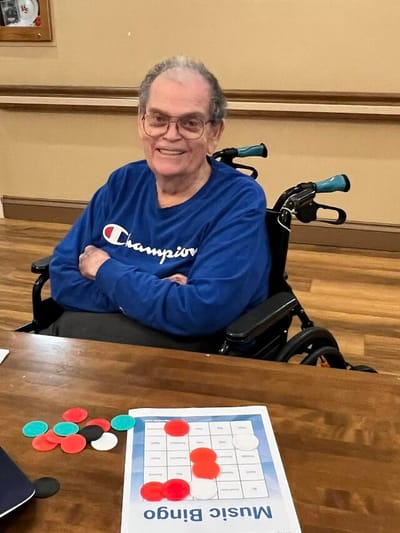 Resident playing bingo in a common area